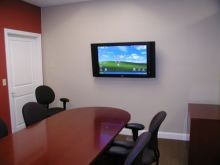 Agency Conference Room with large screen computer screen - great for conferences and reviews!